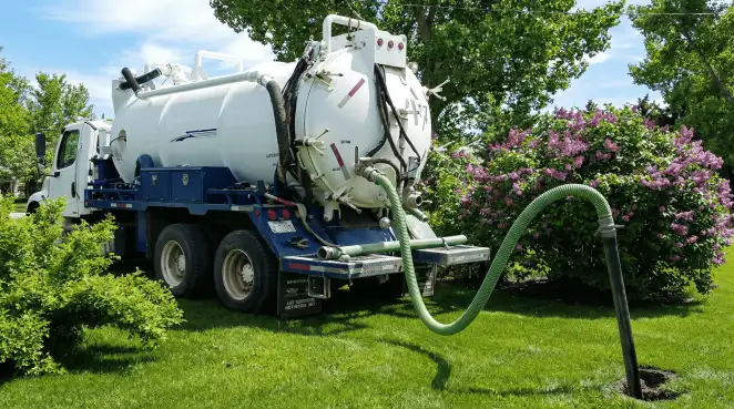 Professional vacuum truck performing residential drainage and septic maintenance in New Haven, CT